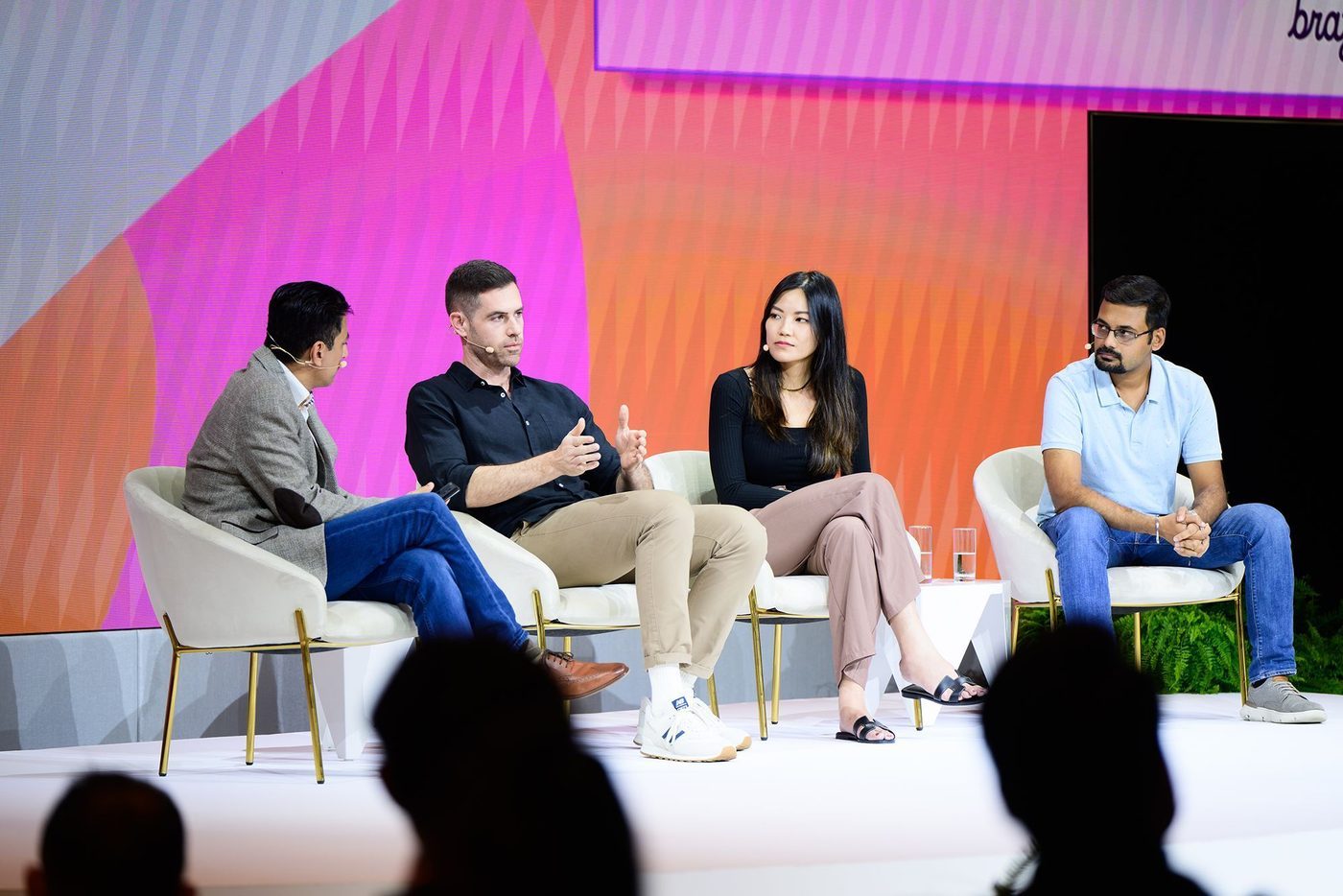 Nicole Chin speaking on a panel discussion at Braze CxC